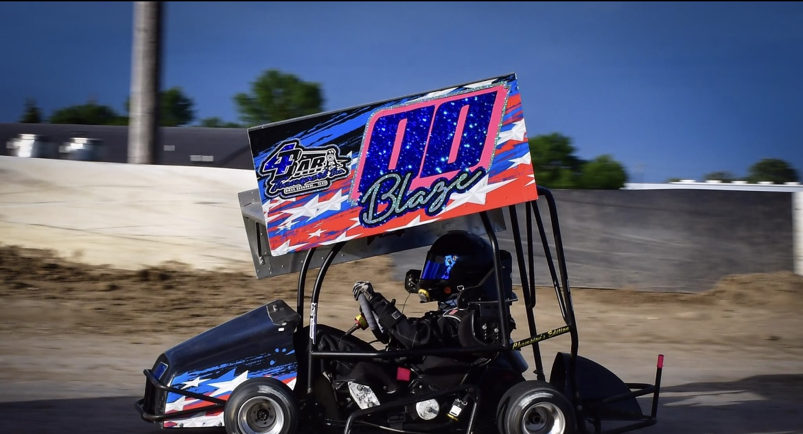 child racing in go kart