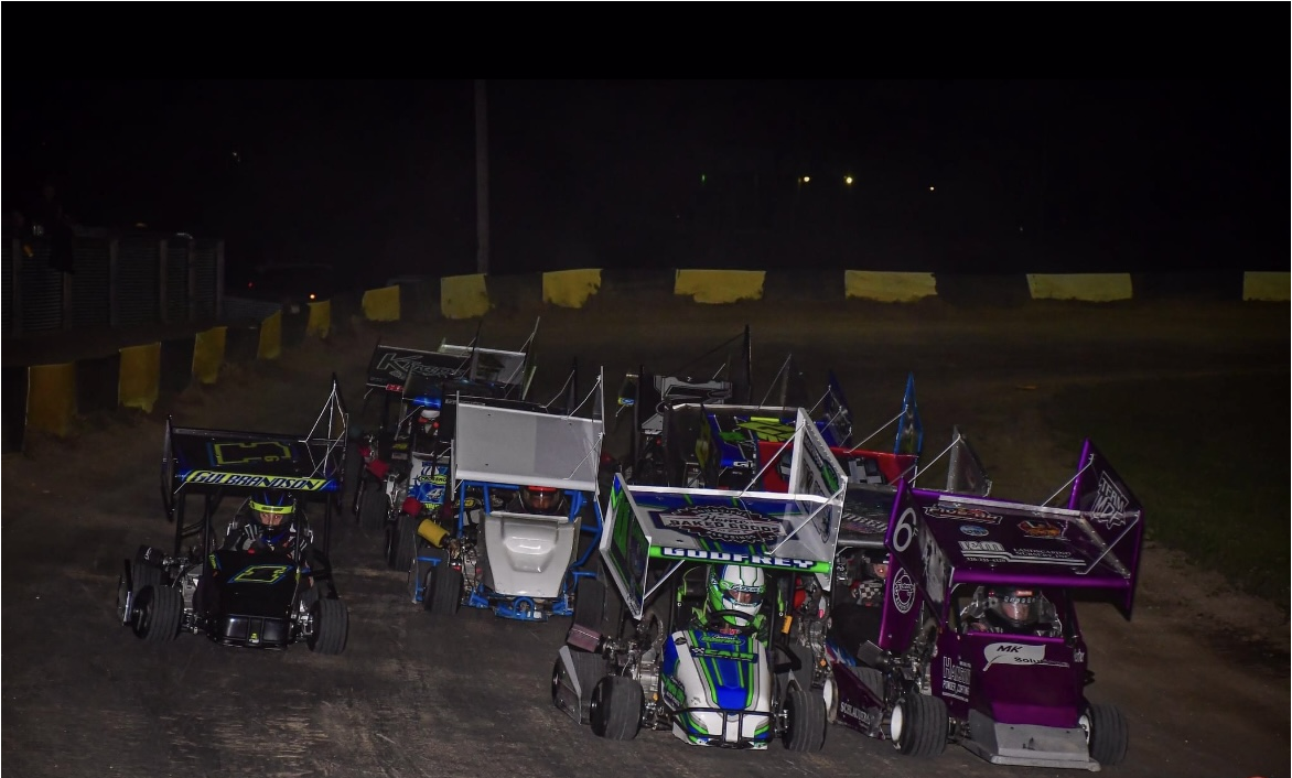 many go karts racing at night