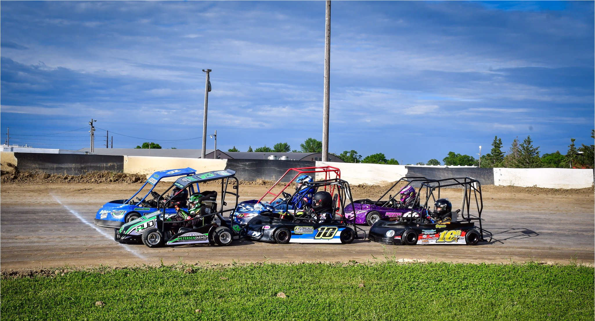 children in go karts racing