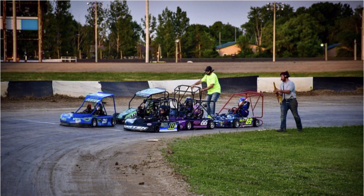 officials helping go kart racers