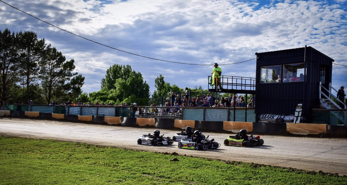 people racing go karts at runestone race track