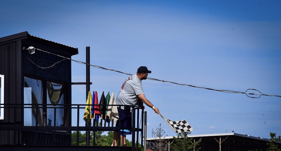 man waving finish flag